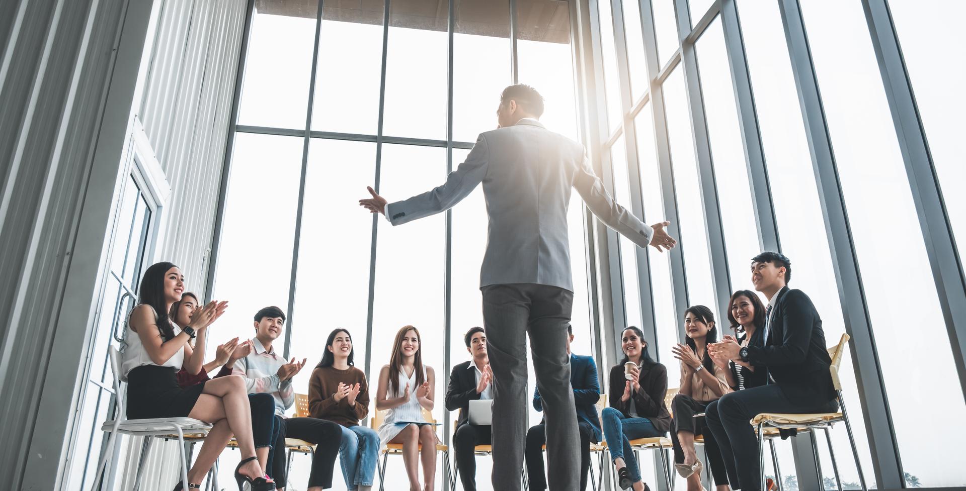 Business people clapping hands during meeting in office for their success in business work