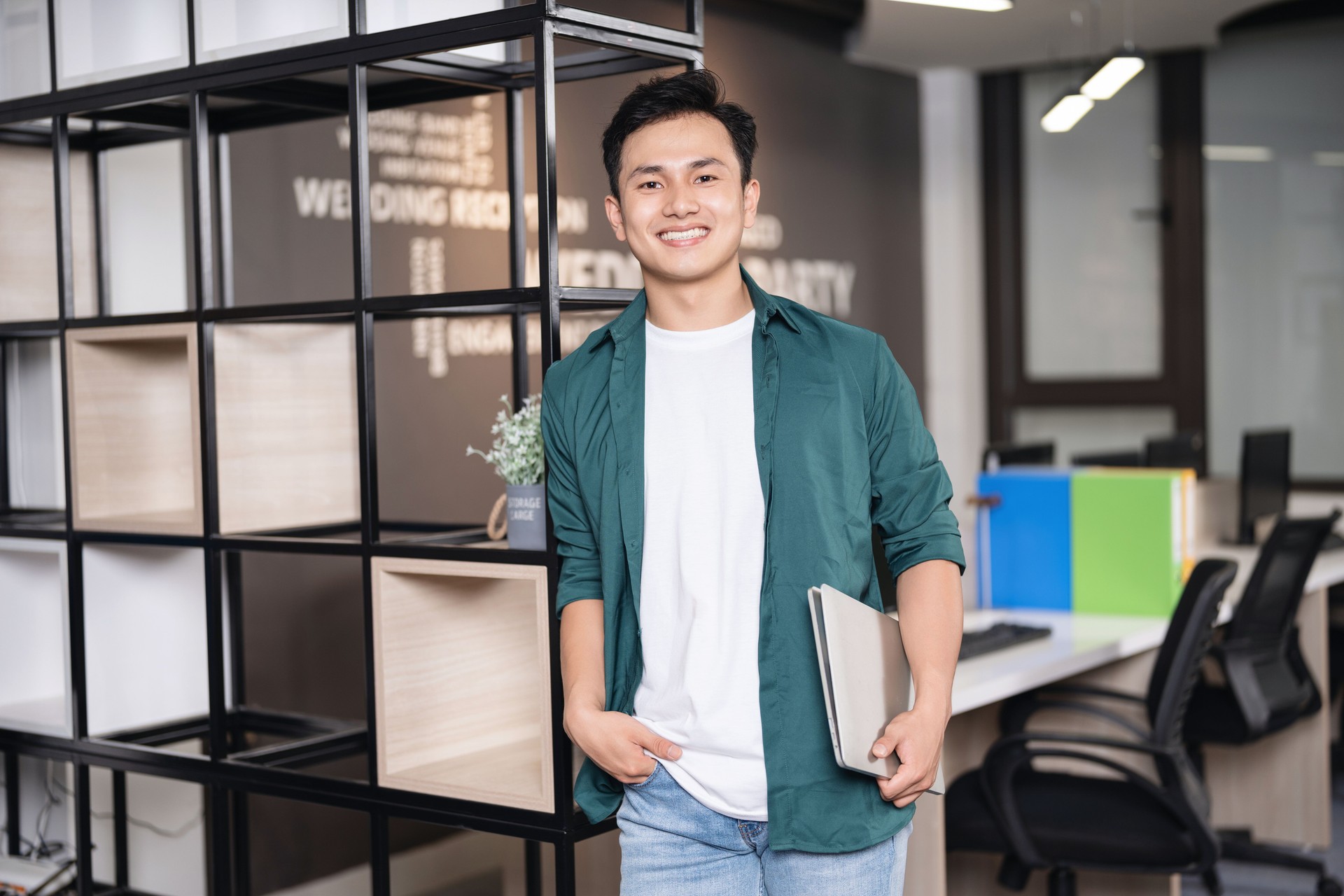 Photo of young Asian businessman working at office